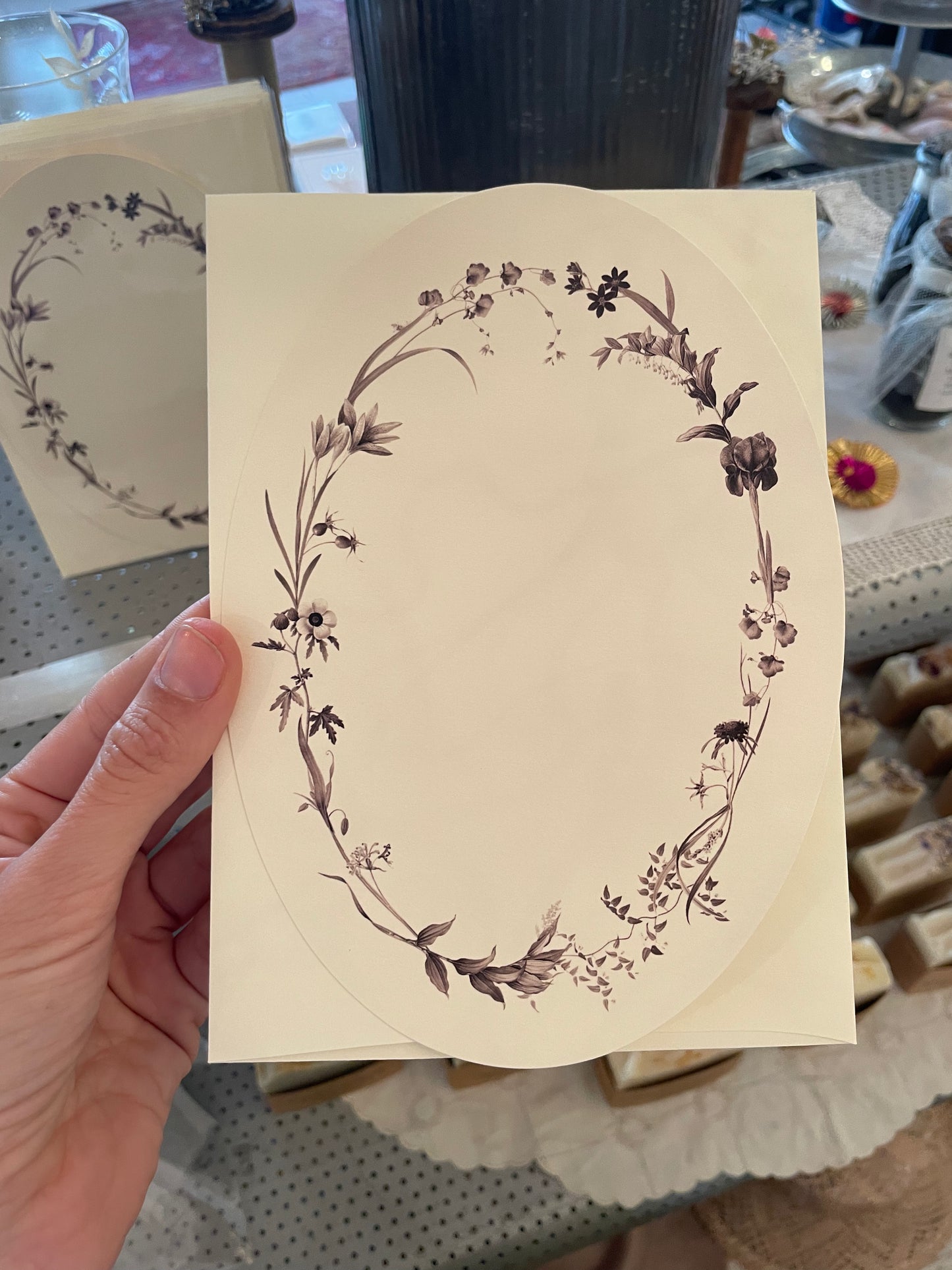 a dark florals oval greeting card with designed and printed in ny
