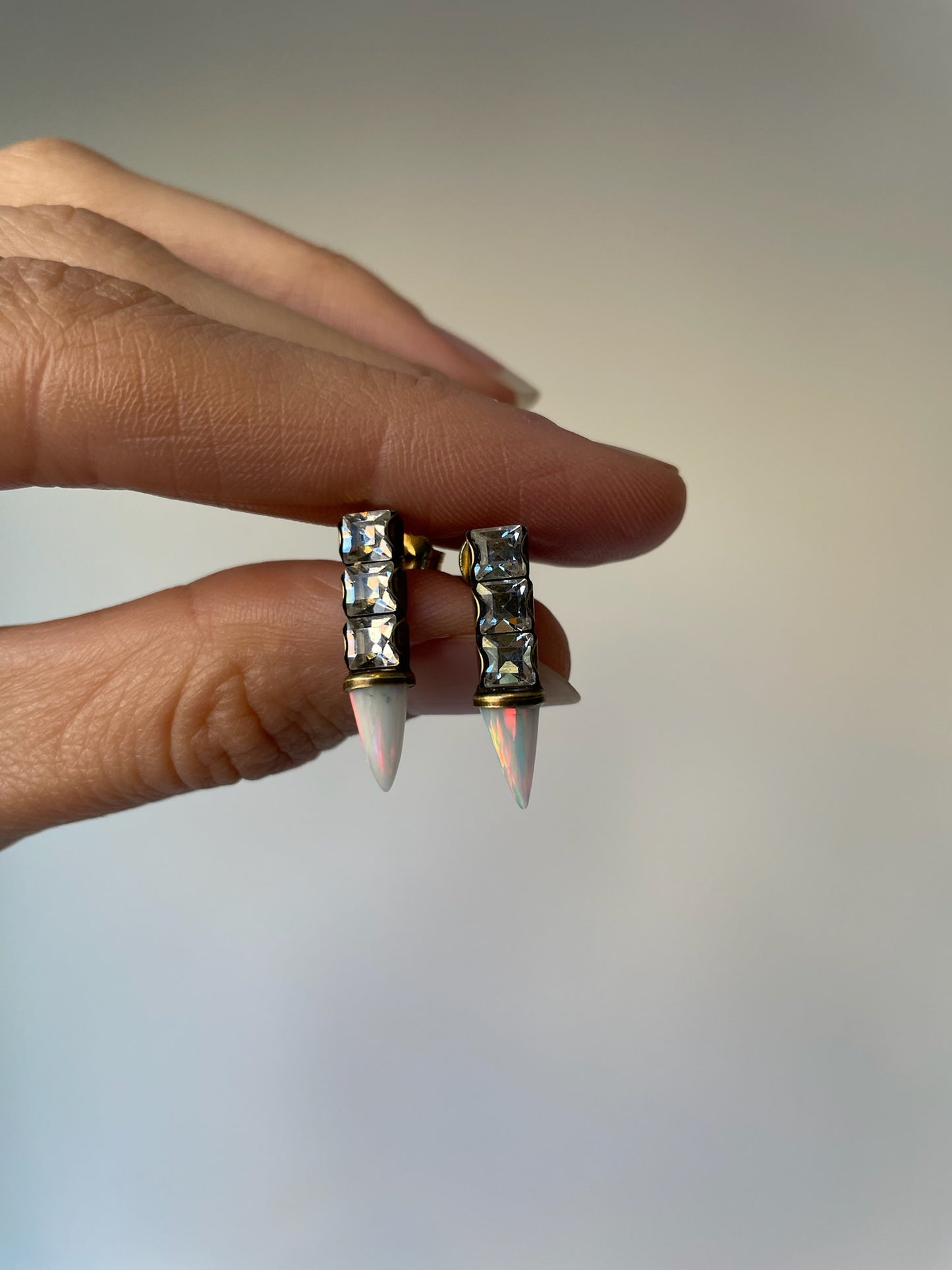Post earrings made of plated brass, featuring swarovski crystals and opalite