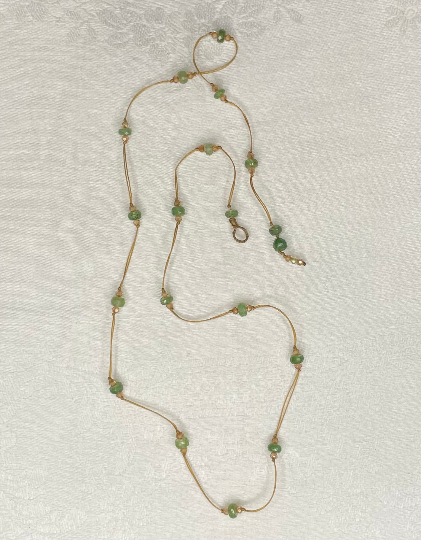 a green tourmaline strand necklace by sharing