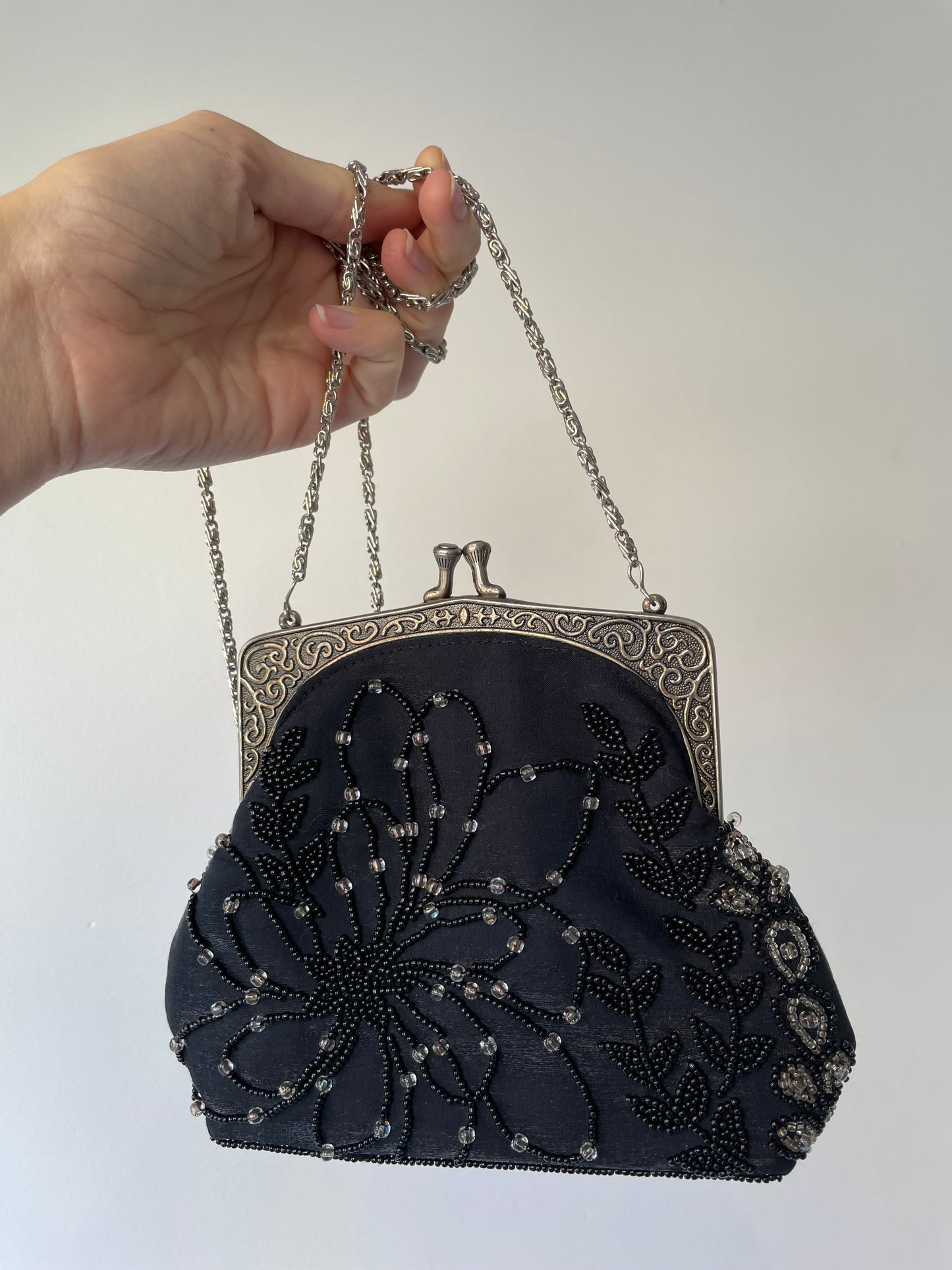 a vintage satin beaded purse in black