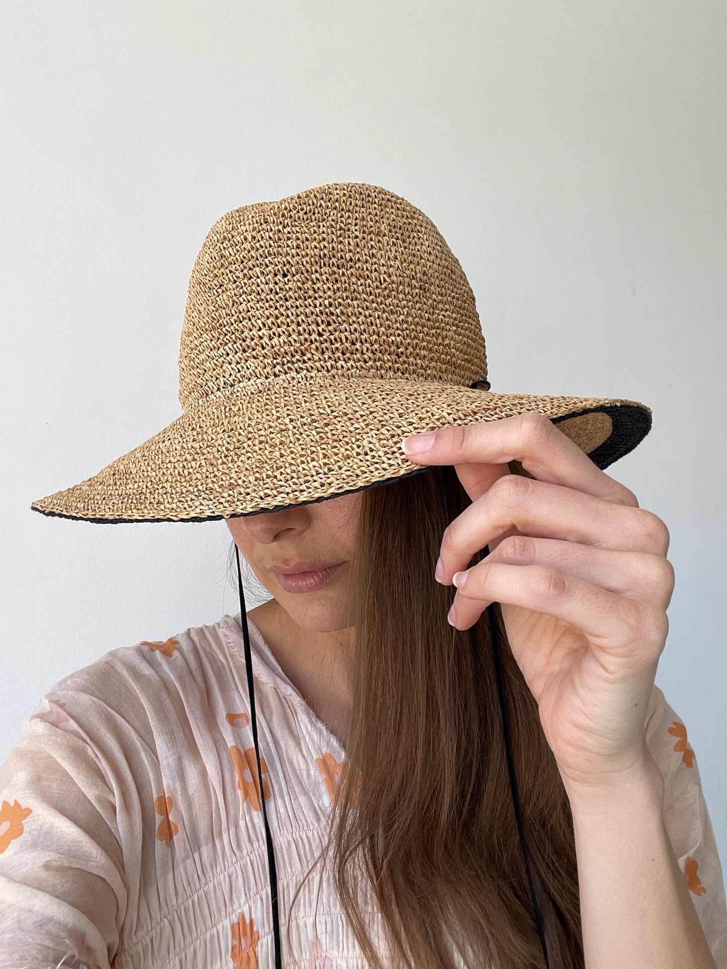 a chisaki kupu hat with recycled paper/polyester blend