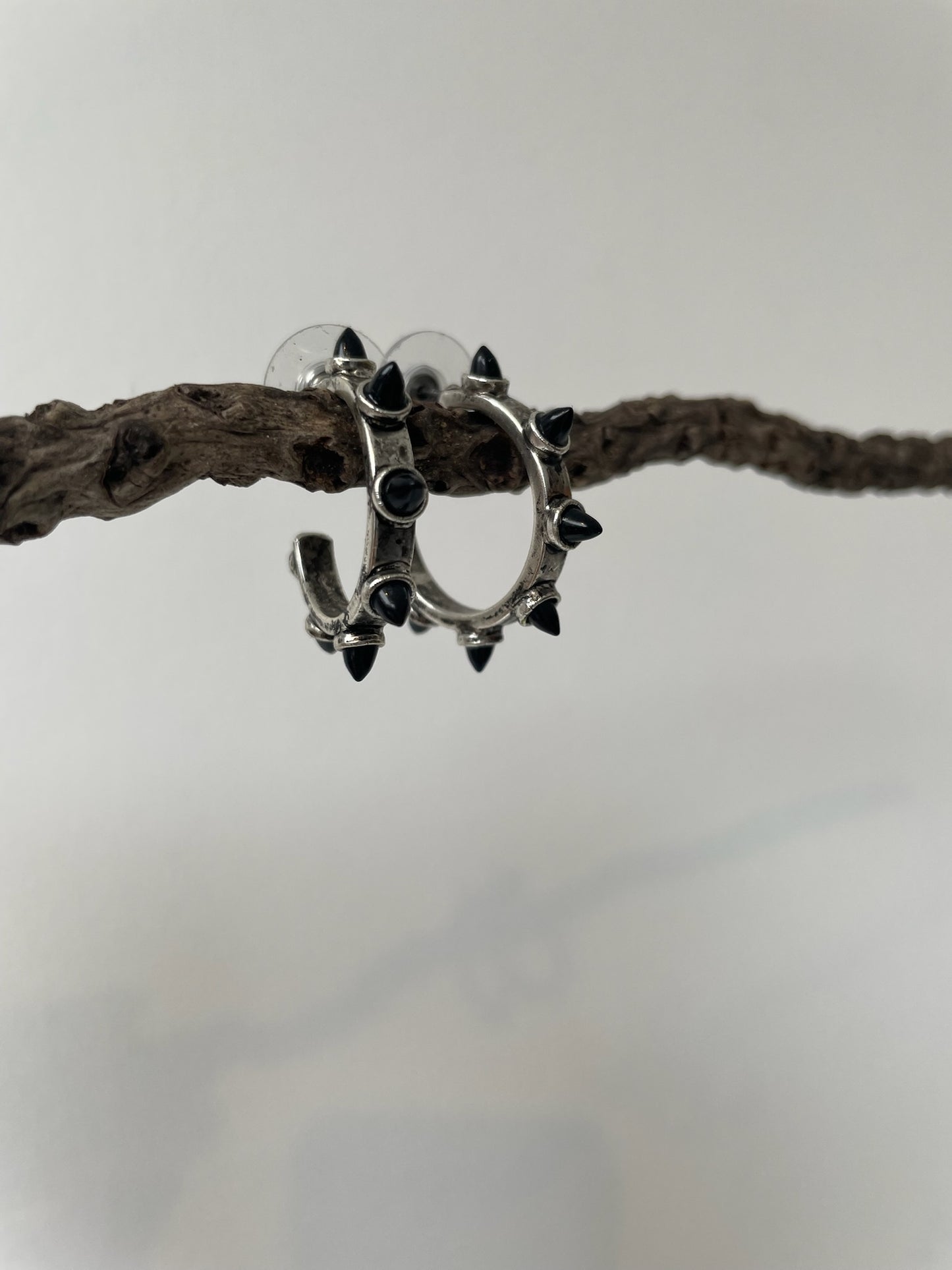 a lionette yuvi earrings with simulated black opals, silver plated hoops