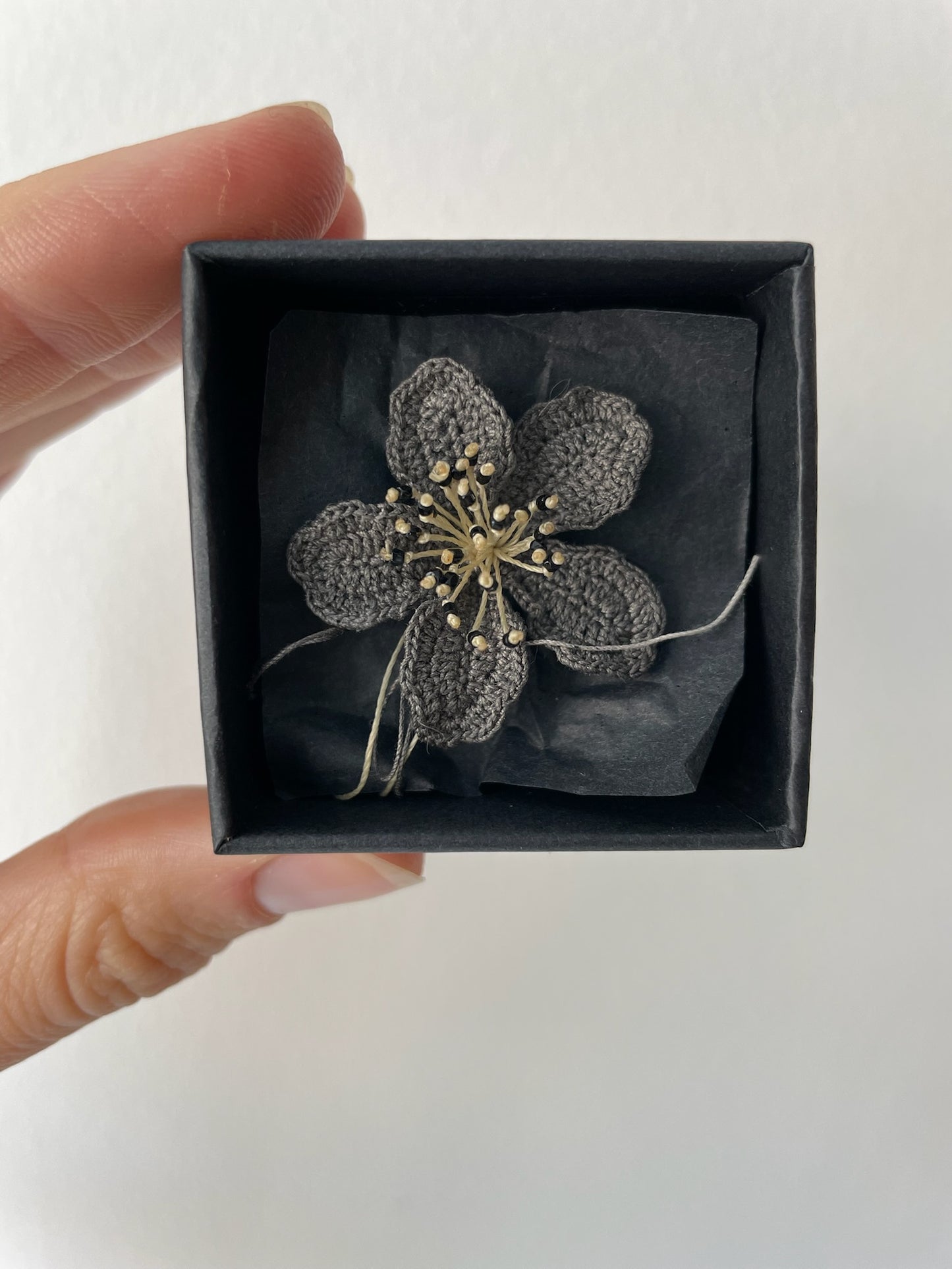 a sarah lattes black flower pin