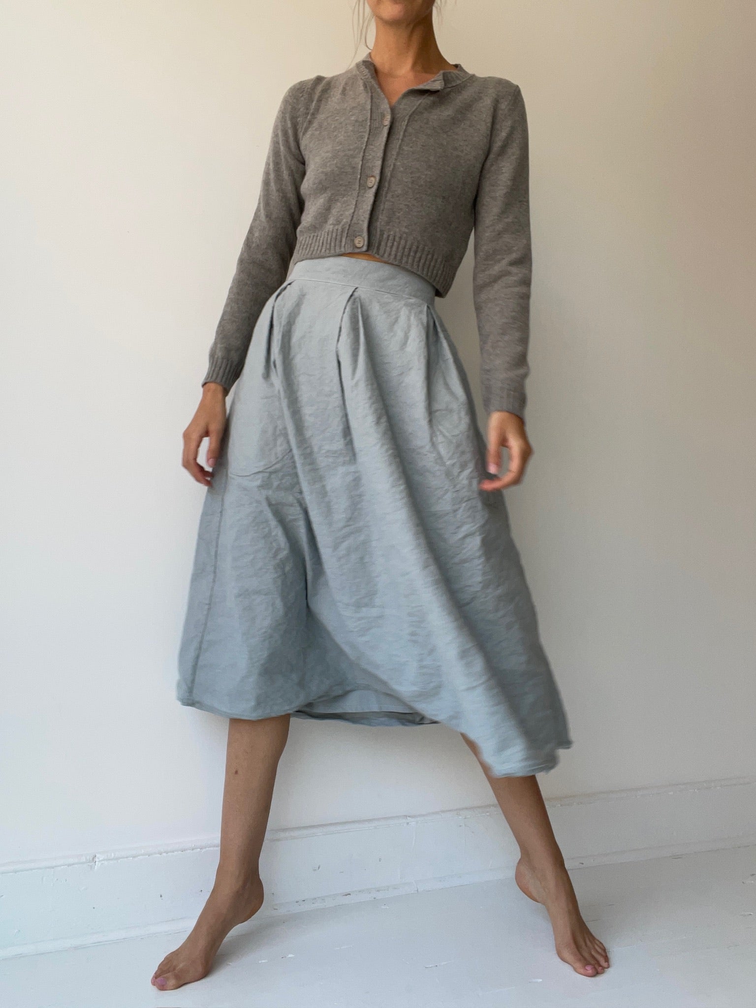 an aequamente short cardigan with 100%