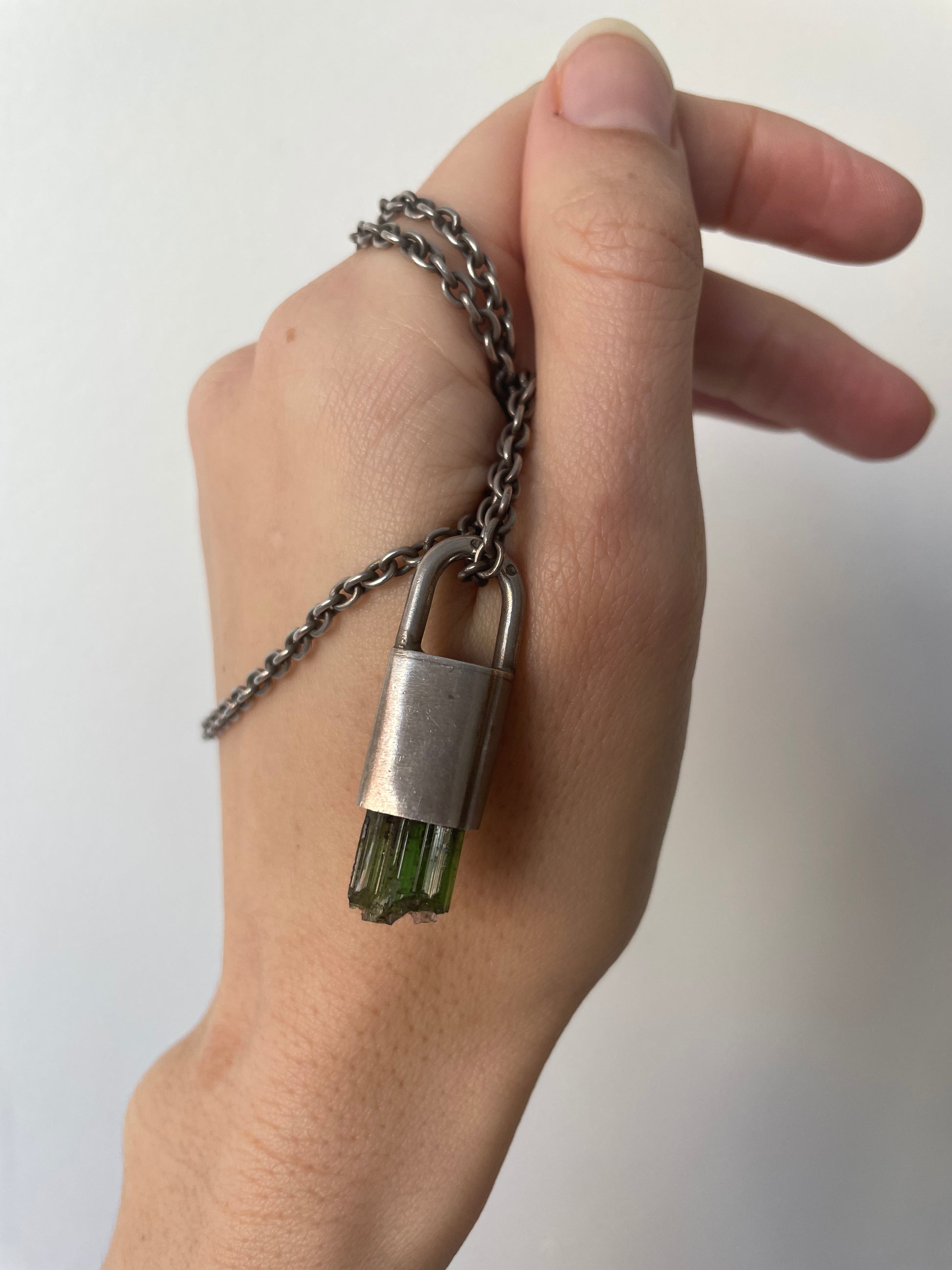 a parts of 4 green tourmaline talisman necklace