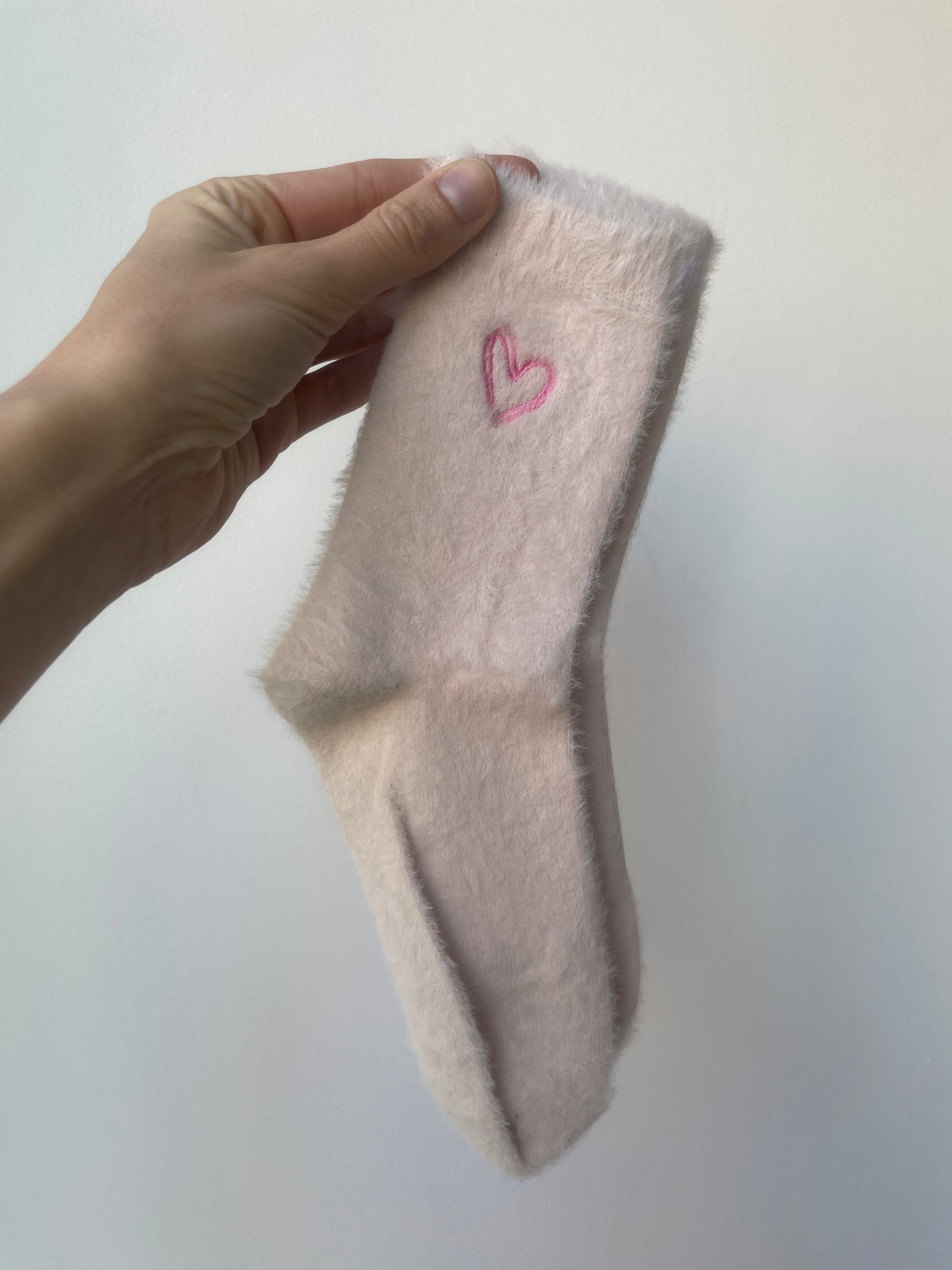 pale pink soft fuzzy socks with pink heart 