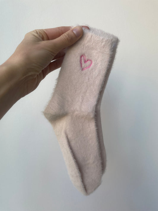 pale pink soft fuzzy socks with pink heart 