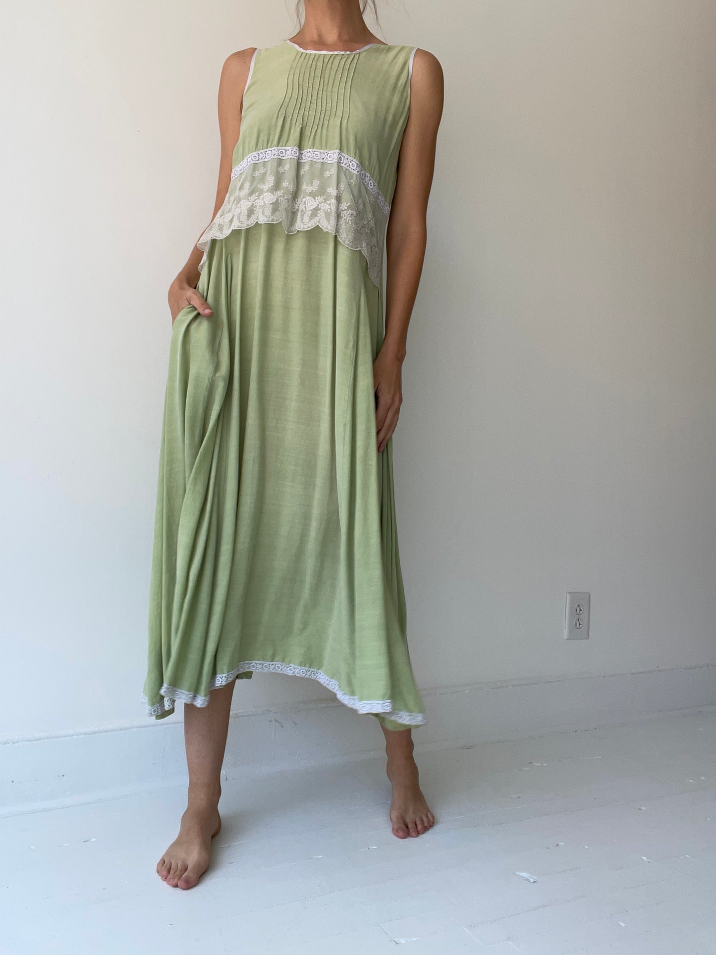 a preloved green lace dress