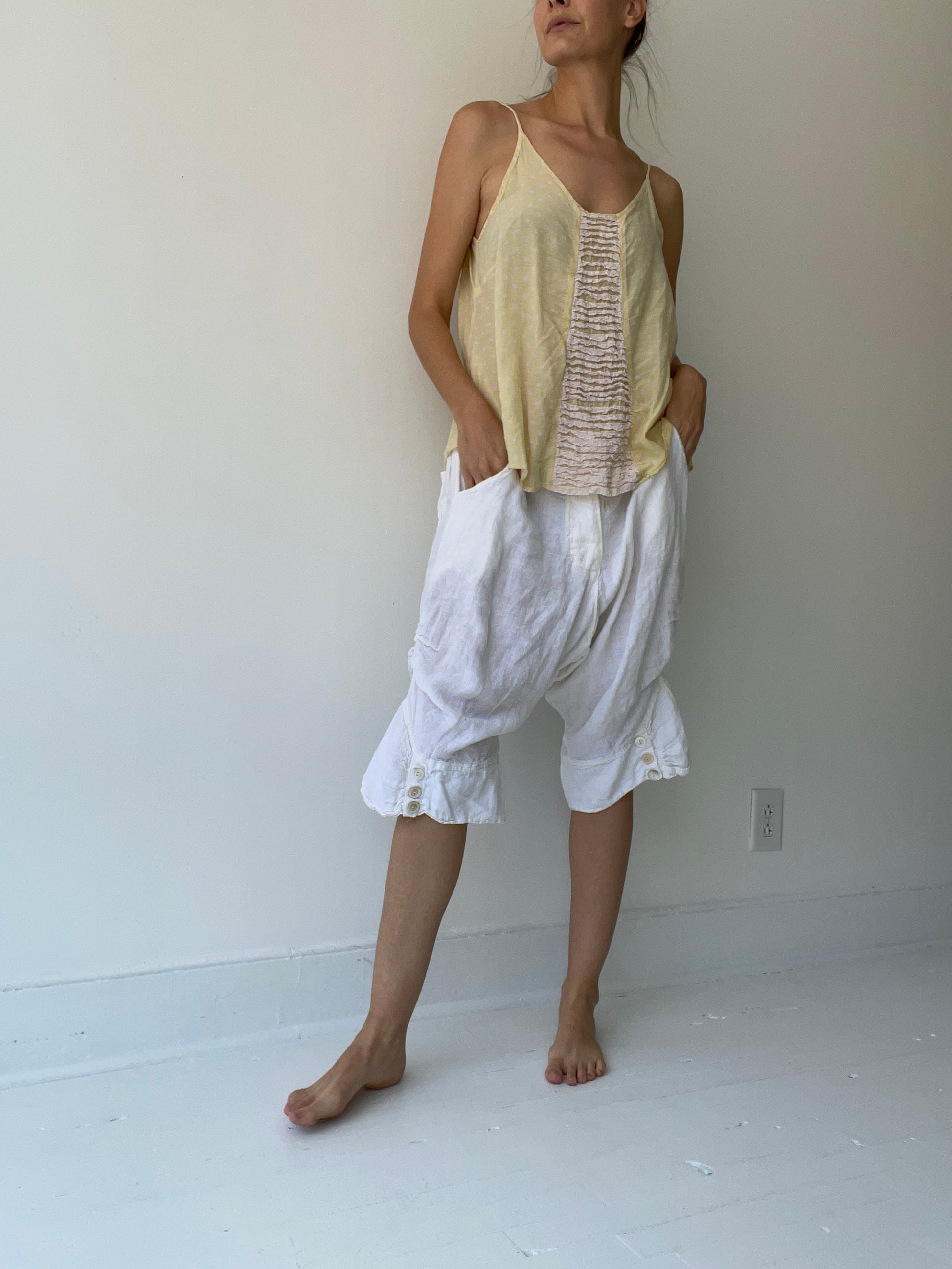 a preloved yellow tank top by magnolia pearl 100