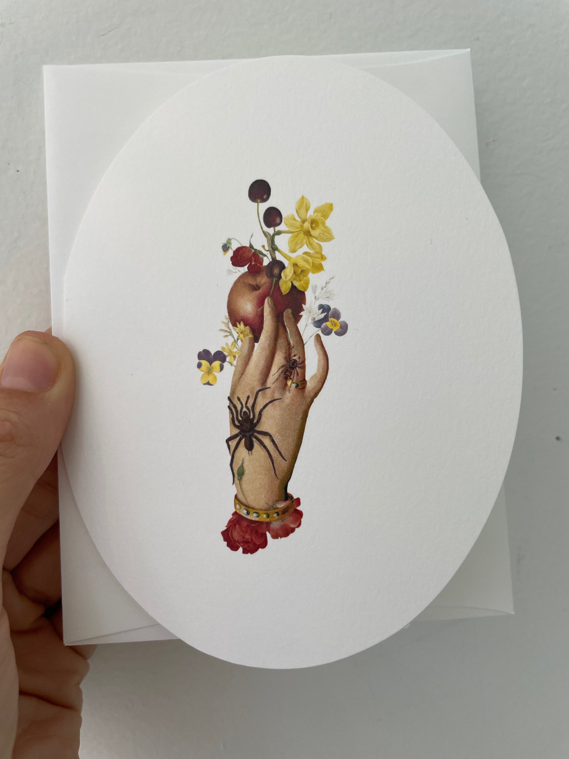 an apple spider oval greeting card with designed and printed in ny