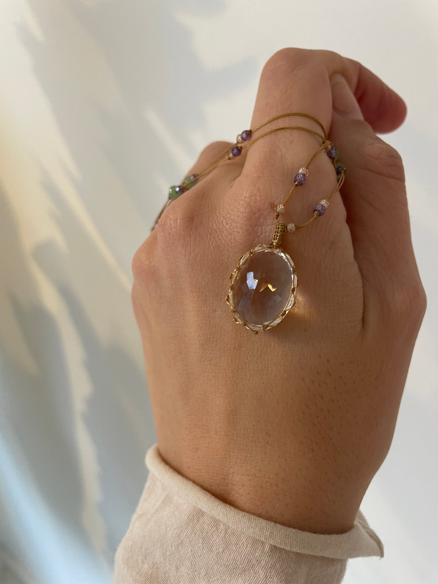 a crystal quartz pendant by sharing