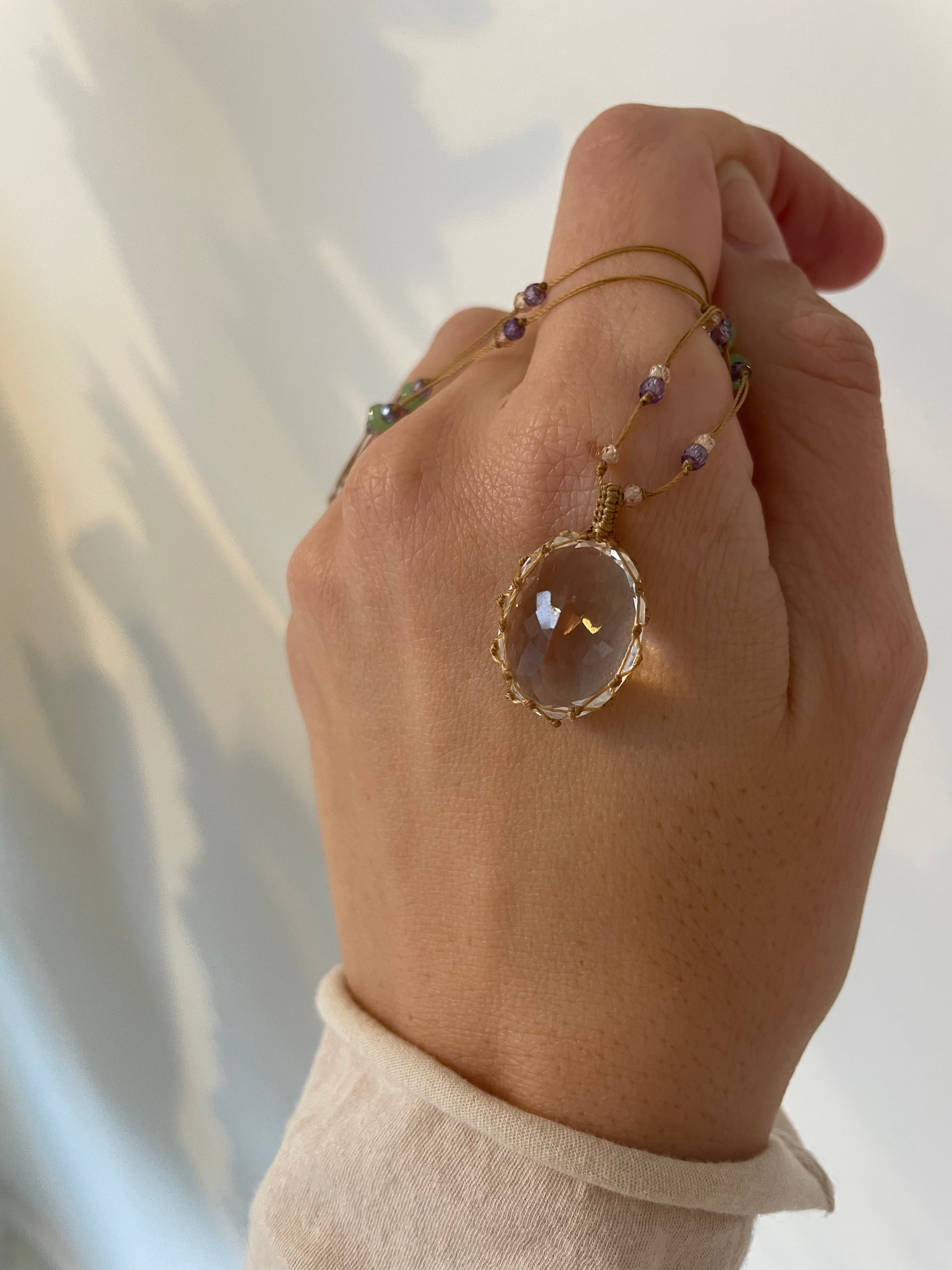 a crystal quartz pendant by sharing