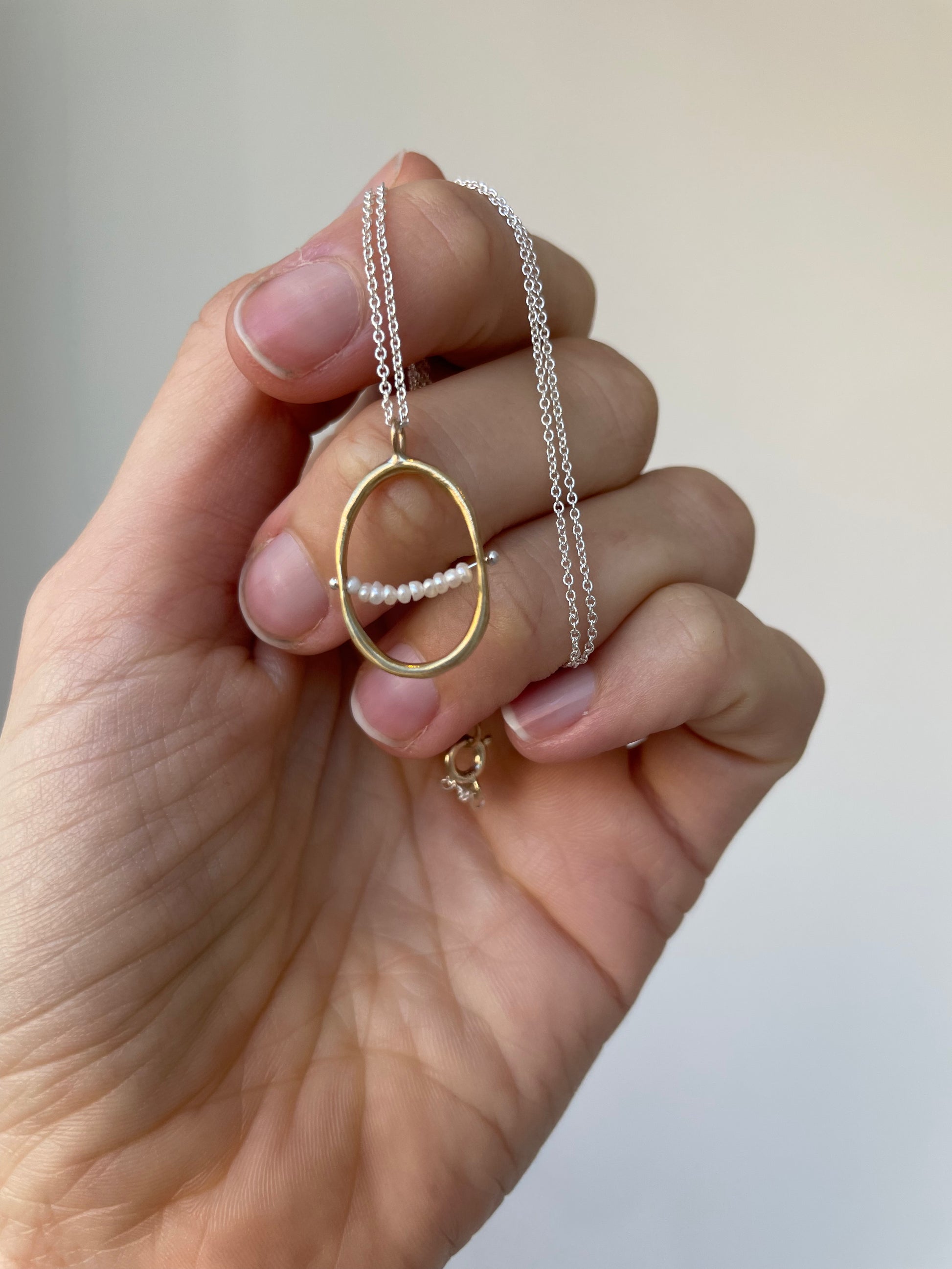 a baby seed pearl necklace