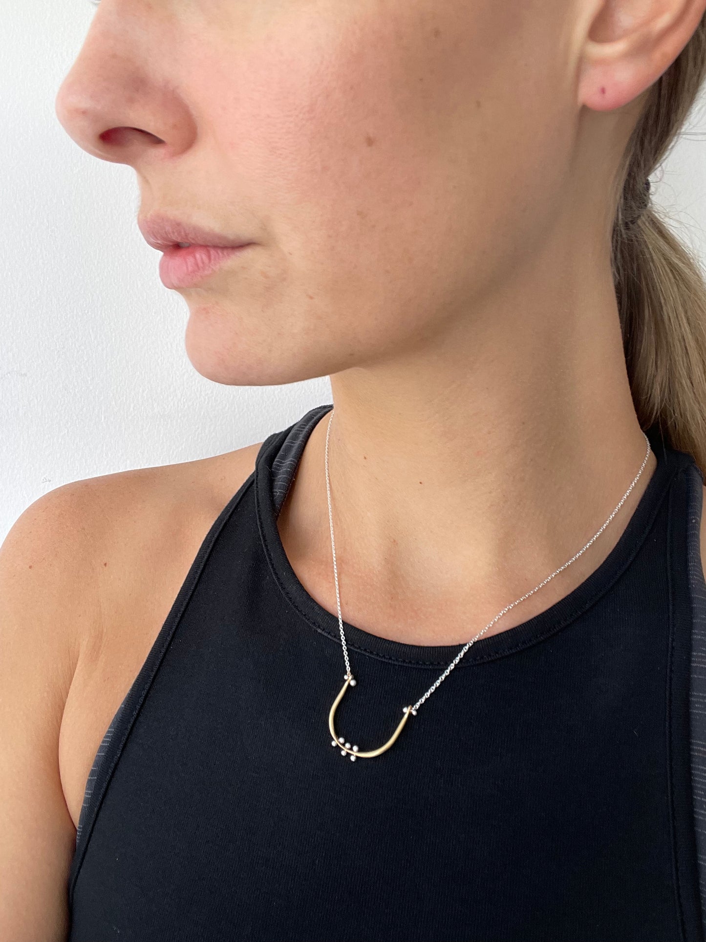 a baby u necklace